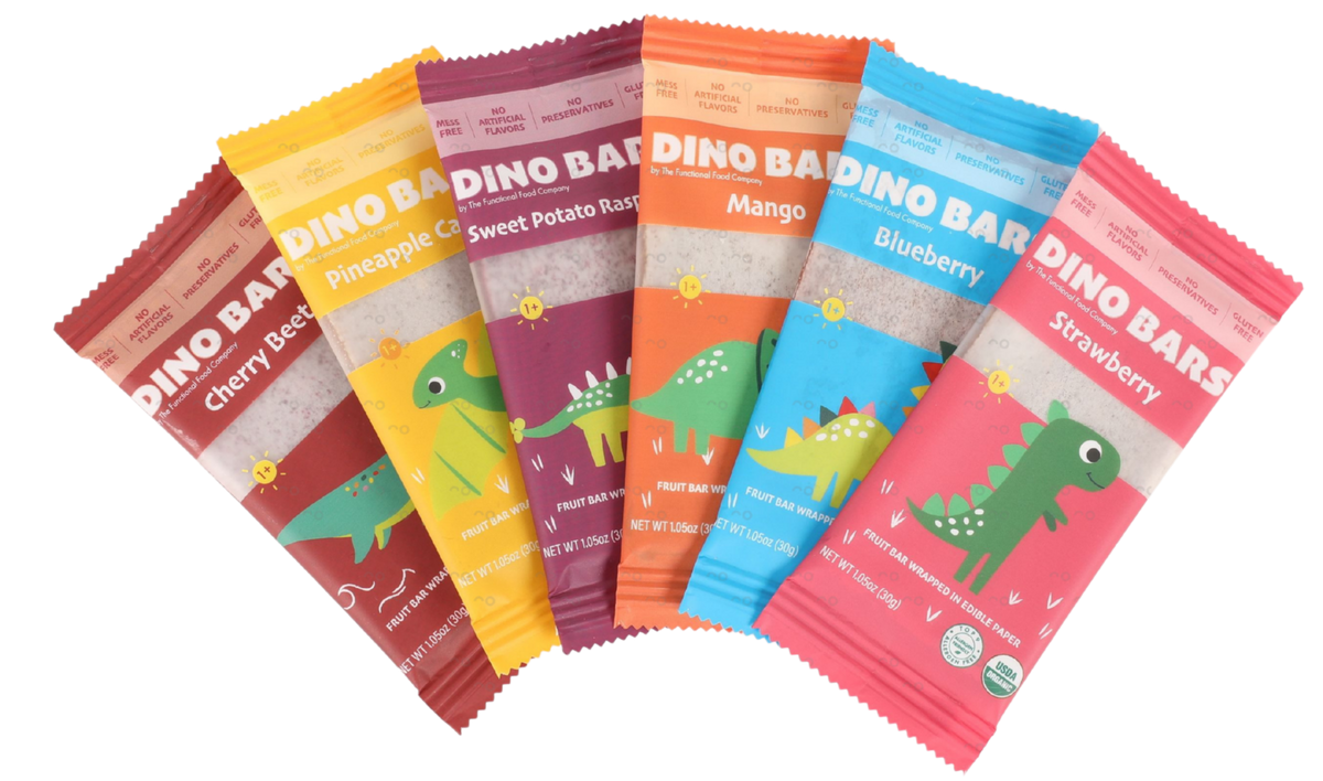 Six colorful DINO BAR snack packets fanned out on a white background, featuring flavors: Cherry Bacon, Pineapple Cinnamon, Sweet Potato Raisin, Mango, Blueberry, and Strawberry. Each packet has a cartoon green dinosaur illustration and the brand name 'DINO BAR' printed prominently.